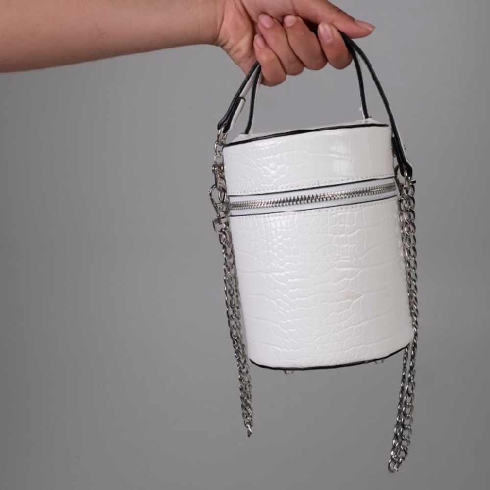 White cylinder cross body handbag
